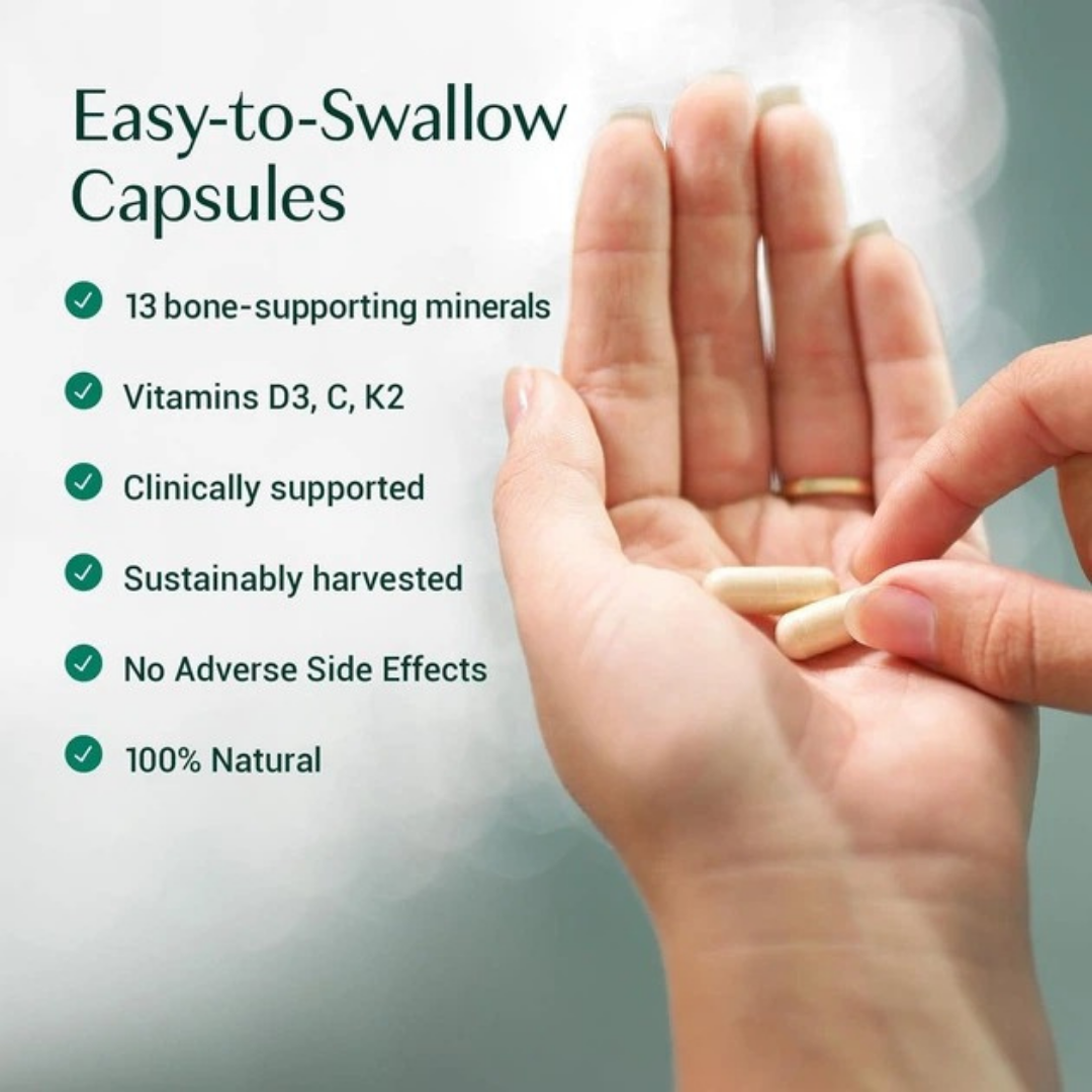 Hand holding two capsules with text about easy-to-swallow capsules on a light background